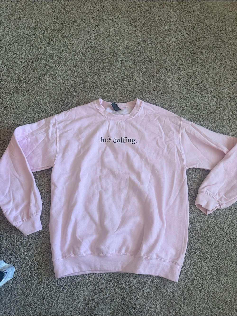Gildan Light Pink Crewneck Sweatshirt with "he's golfing." Chest Text